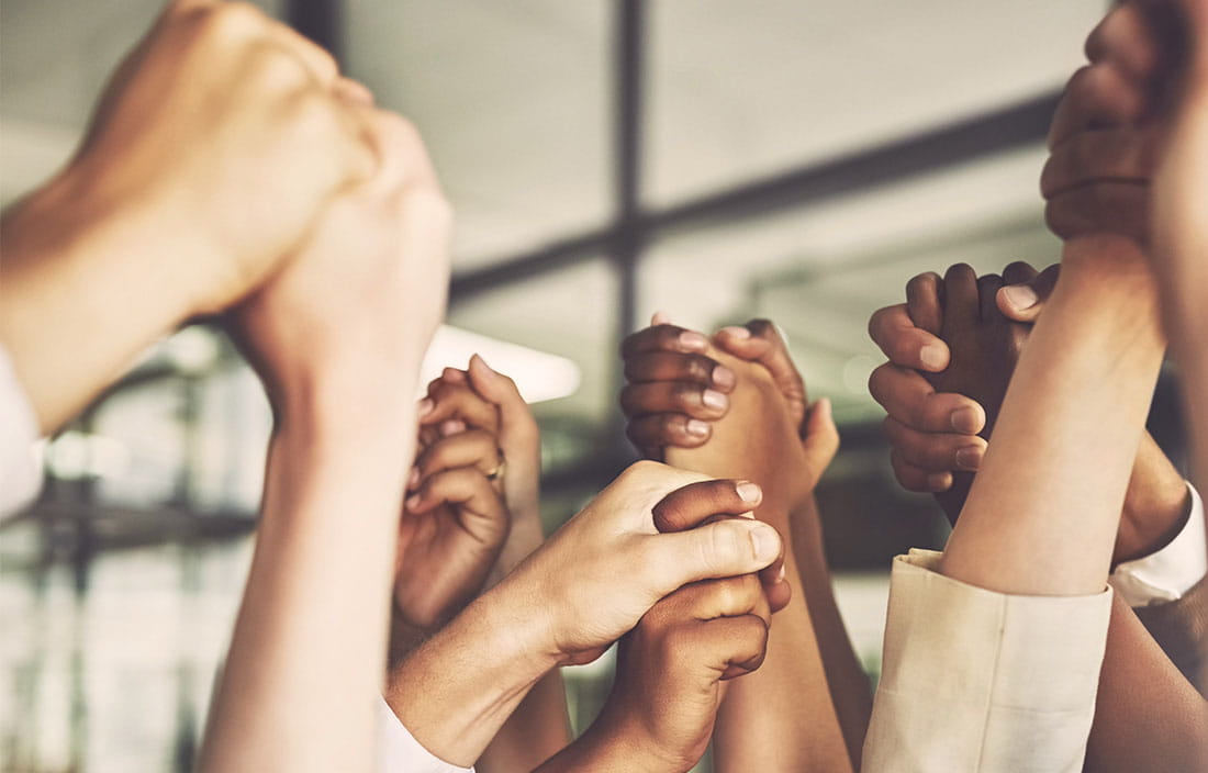 Image of group holding hands