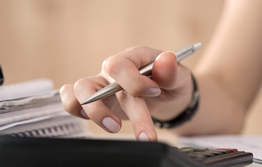 Image of woman on calculator