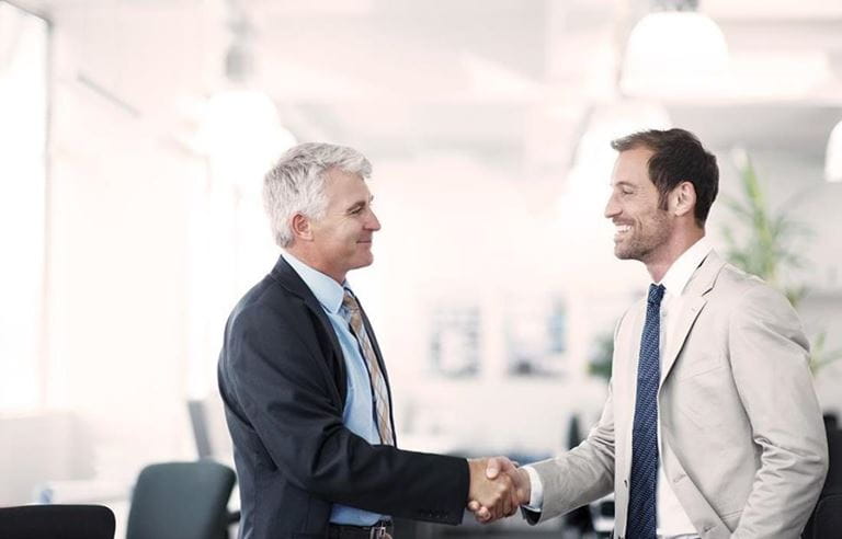 Two professional men shaking hands 