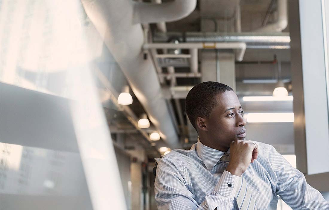 Man in deep thought at desk