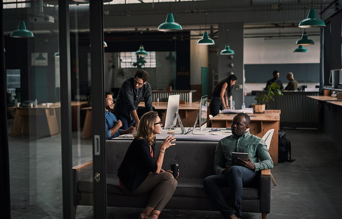 Group of people working in an open space office