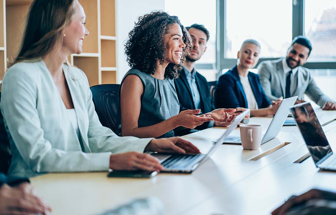 Business professionals speaking in a conference meeting.