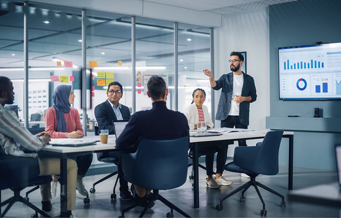 Person presenting data during a meeting.