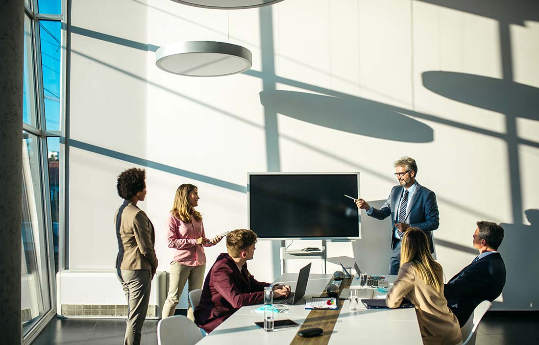 Group of professionals discussing how to conduct business internationally.