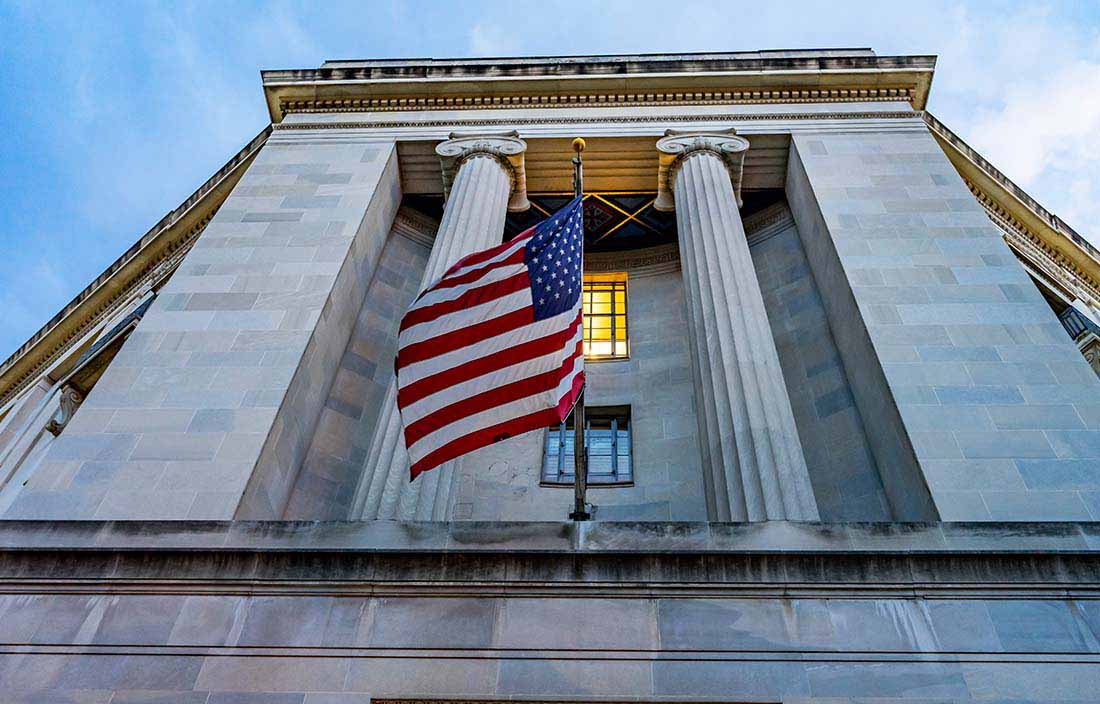 View of government building with American flag.