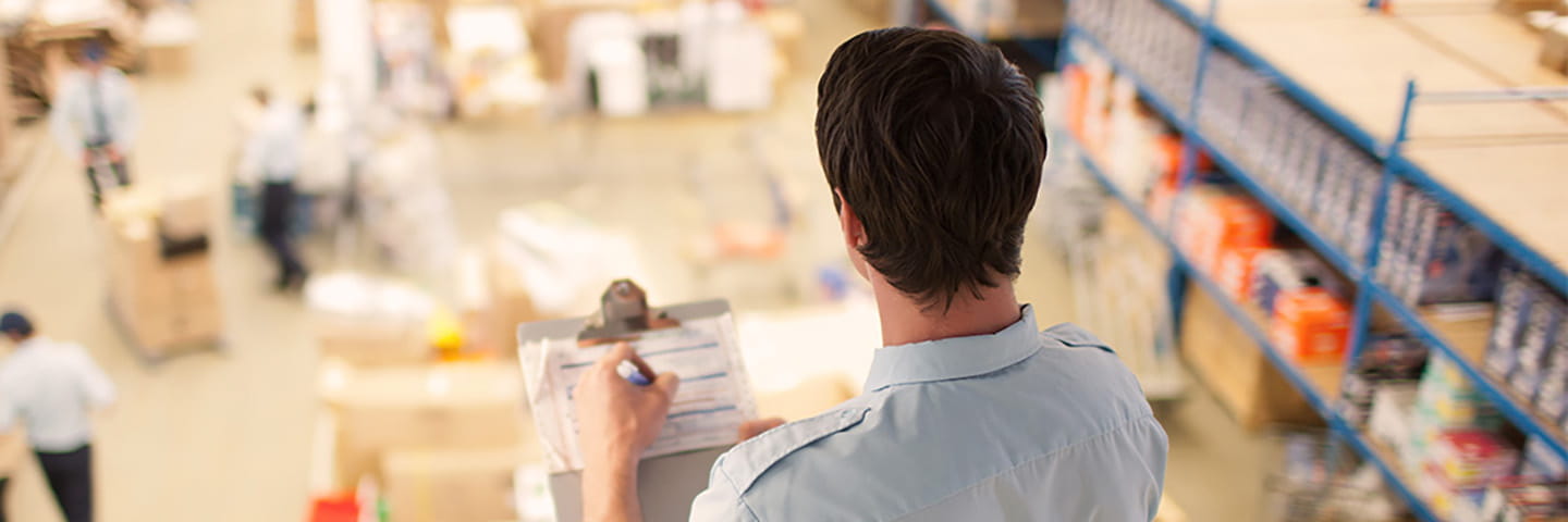 Worker overseeing a shipping and receiving area.