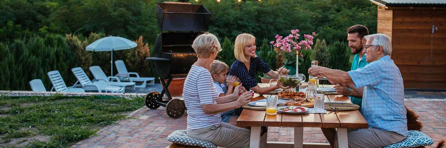 Wealthy family eating dinner and talking about their financial legacy.