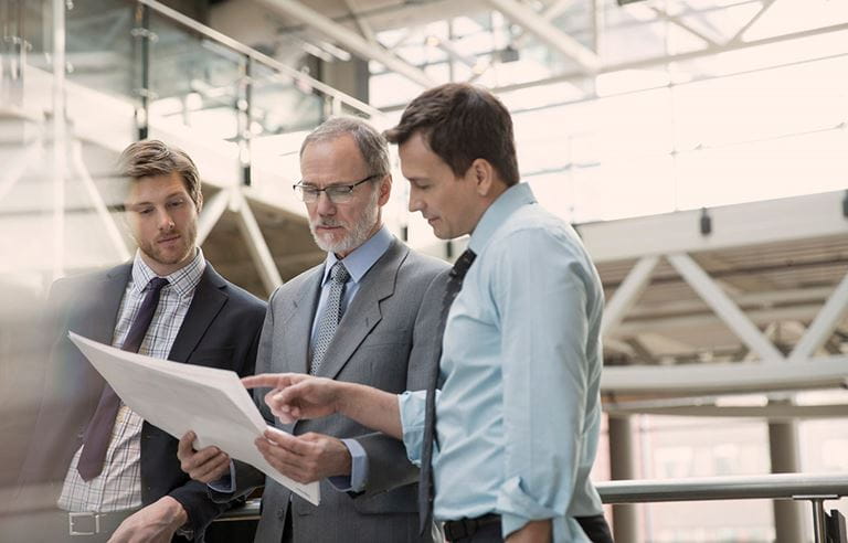 Business people looking at a document