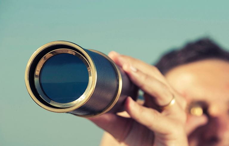 Person holding telescope