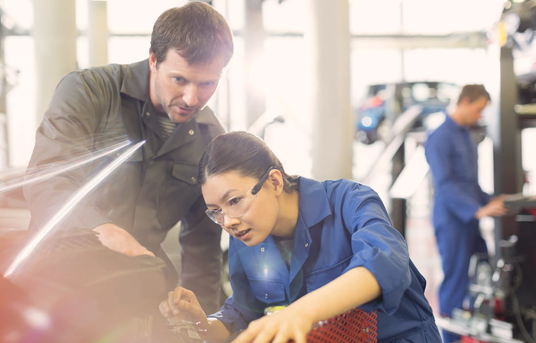 Image of man and woman working in manufacturing plant 