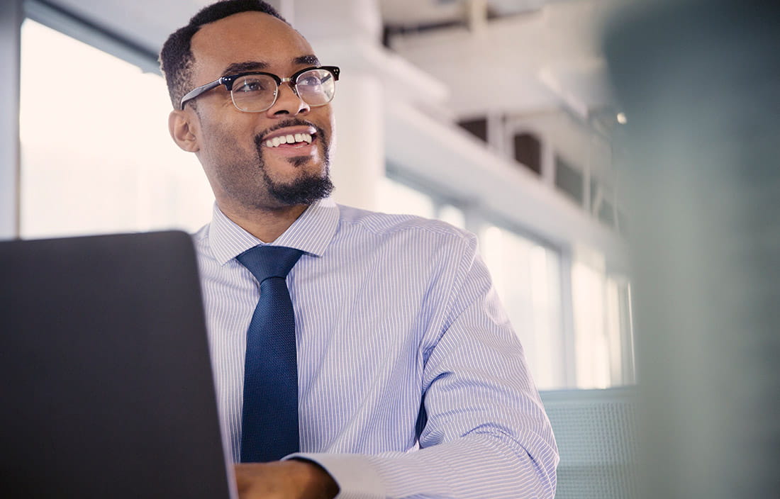 Man at computer reviewing customer data protection protocols 