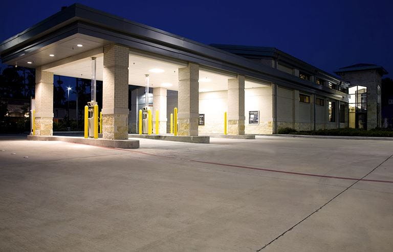 Drive thru of a bank at night time.