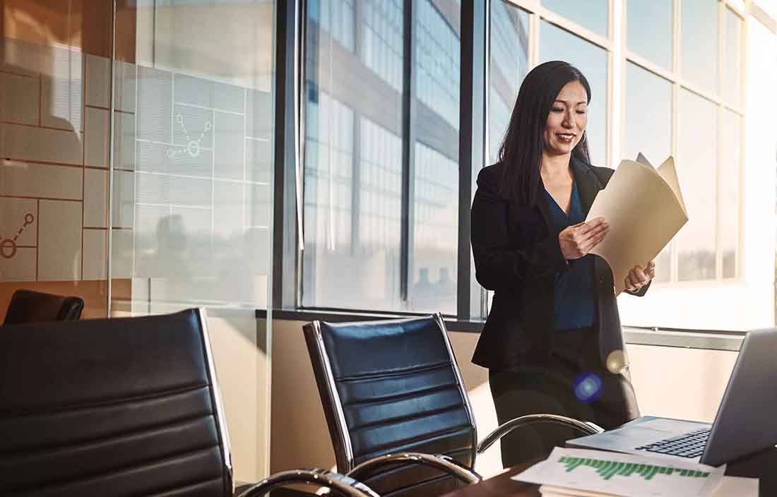 Woman in an office going through papers