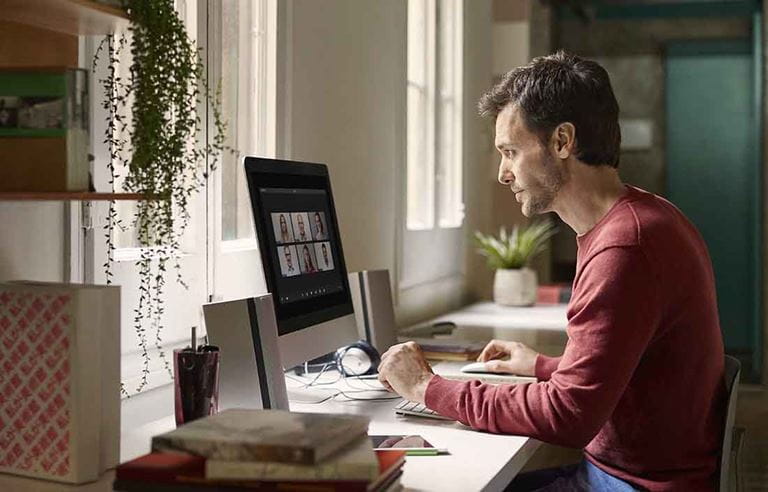 Man working from home a virtual office environment.