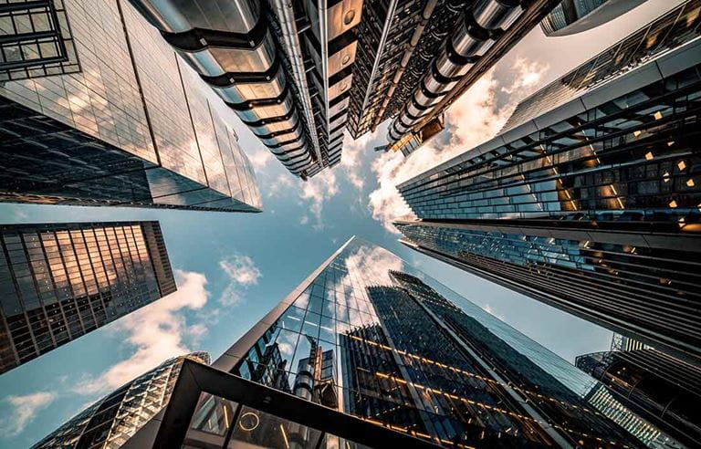 Angled view looking up at city skyscrapers.