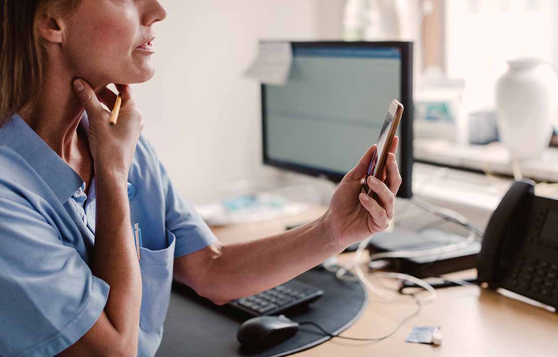 Doctor on a telemedicine call with patient.