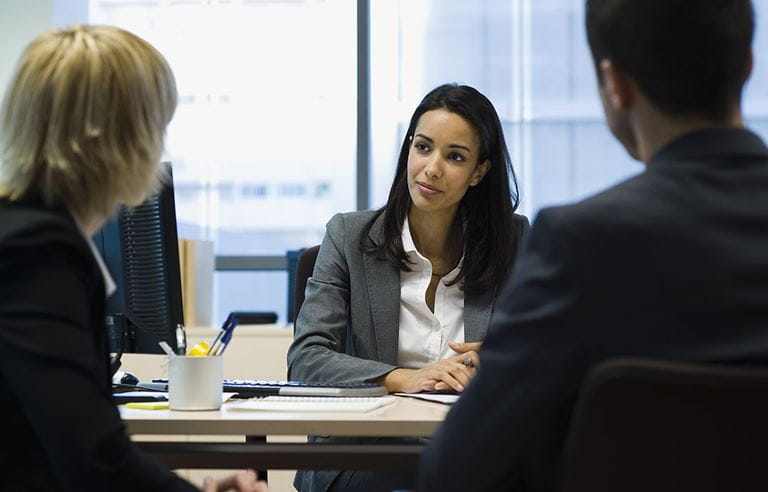 Financial advisor meeting with a couple.