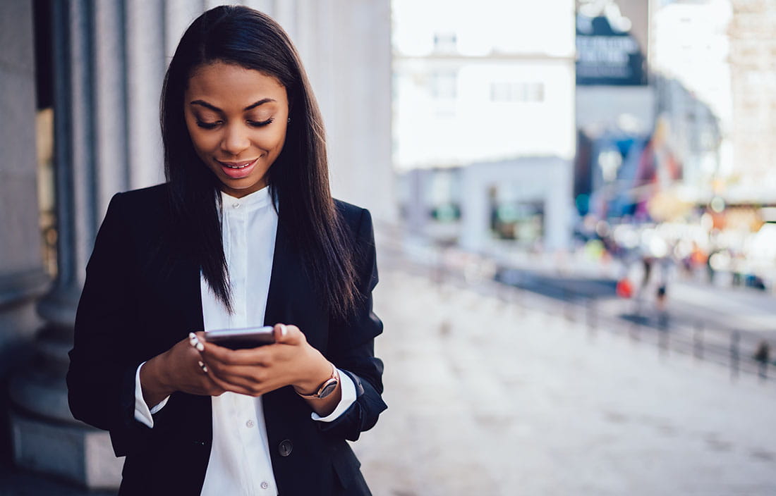 Business professional checking their phone.