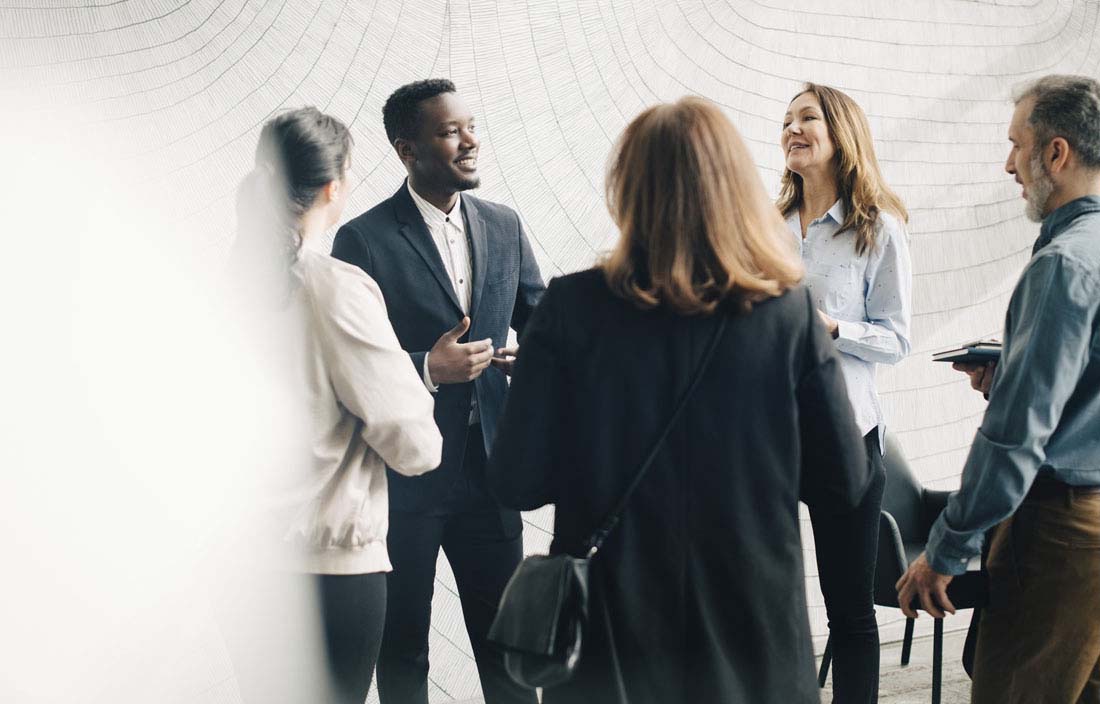 Group of colleagues having a discussion.