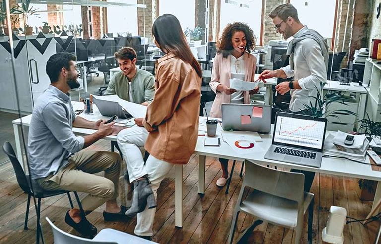 Group of coworkers discussing the importance of cybersecurity.