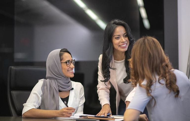 Female business team in strategy meeting.