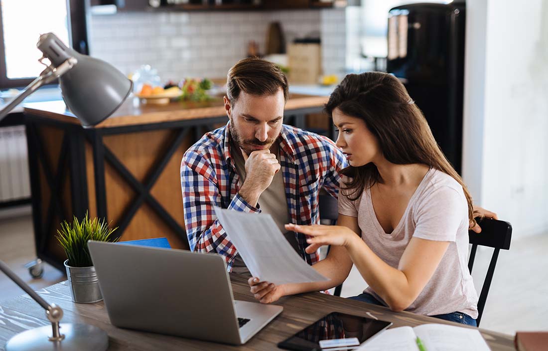 Two people going over their financial portfolio.