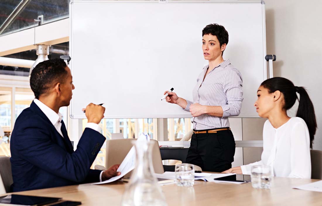 Business professionals in a modern conference room discussing Section 958.