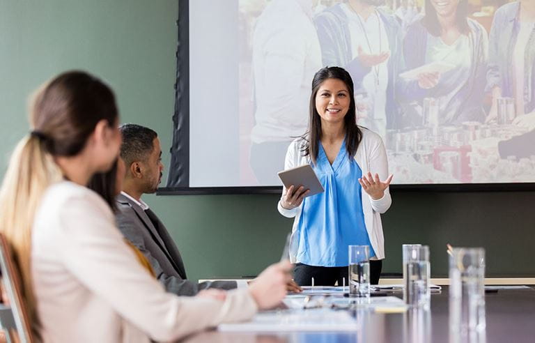 Three business professionals having a meeting discussing digital transformation