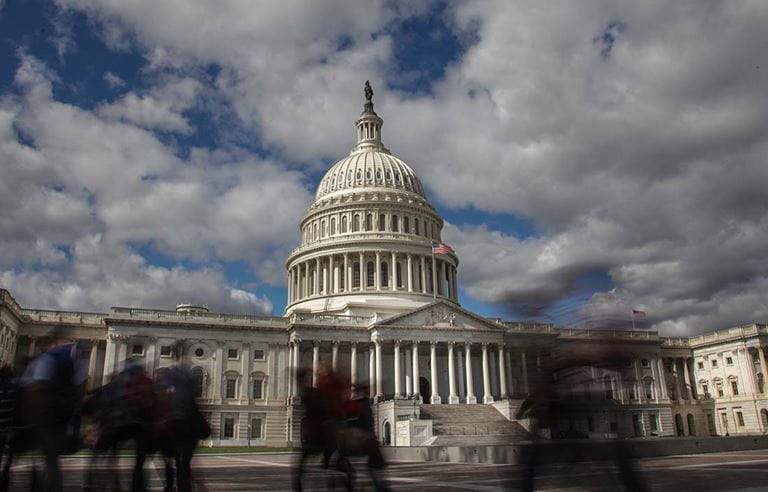 U.S. Capitol building during the day against a cloudy sky.