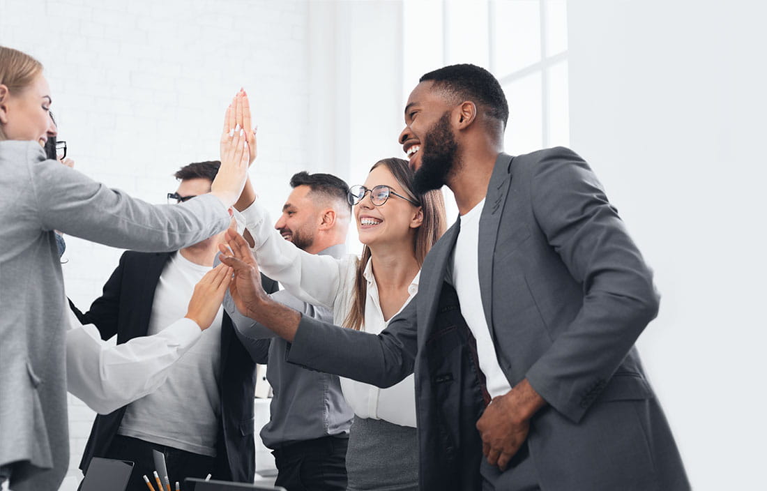 Group of financial advisors celebrating.