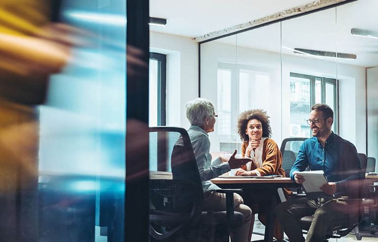 Business executives meeting in a modern conference room.