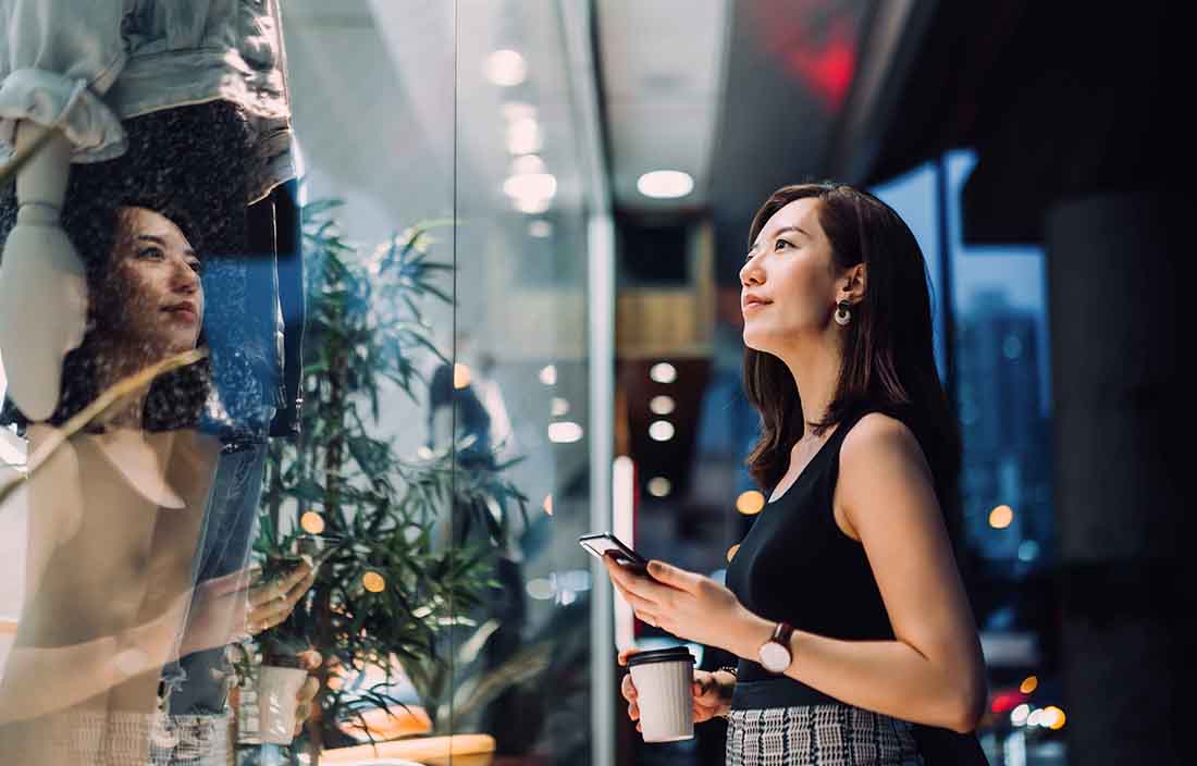 Customer looking into a shop window. 