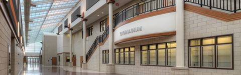 Interior view of Van Buren High School's hallway and gymnasium.