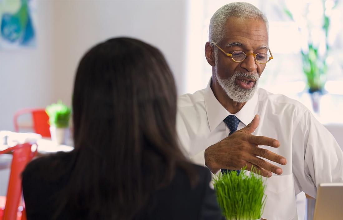 Two people in a discussion