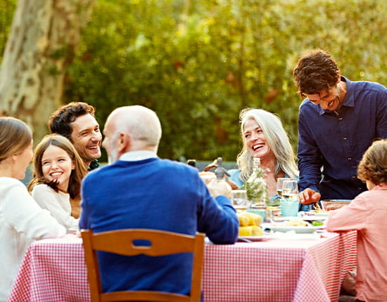 Family having dinner outside.