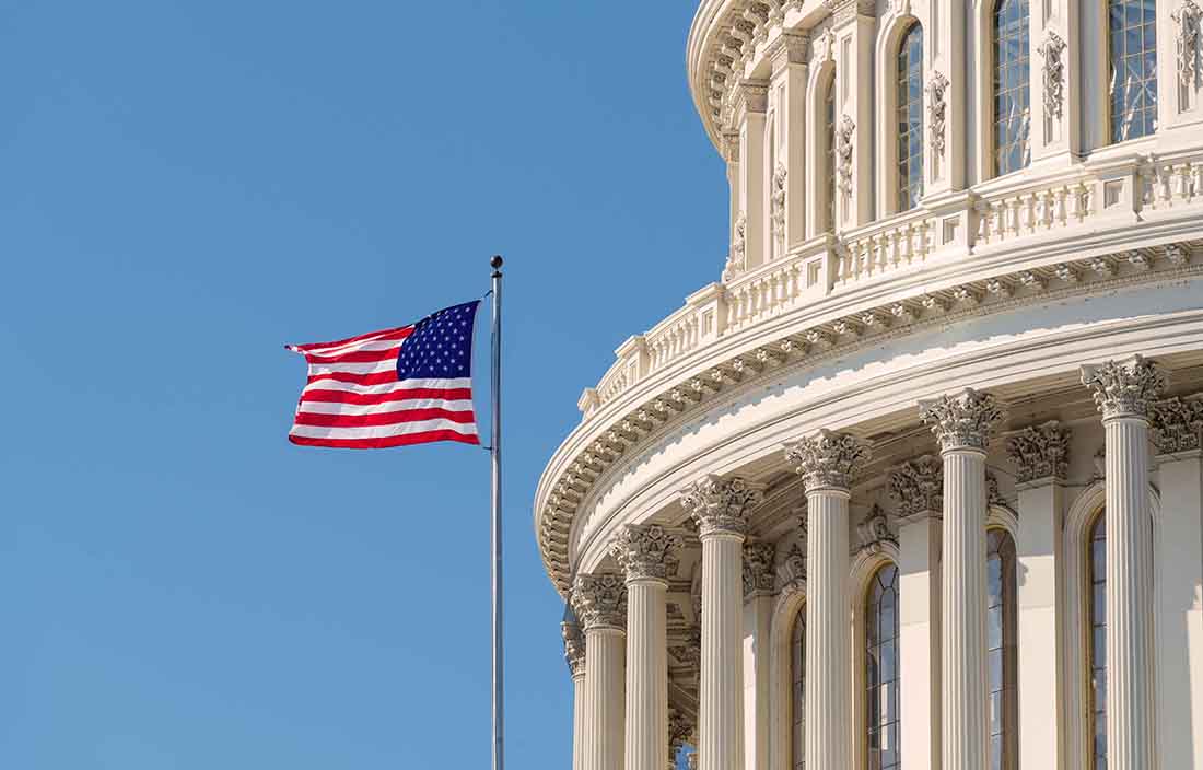 Capital building with American flag