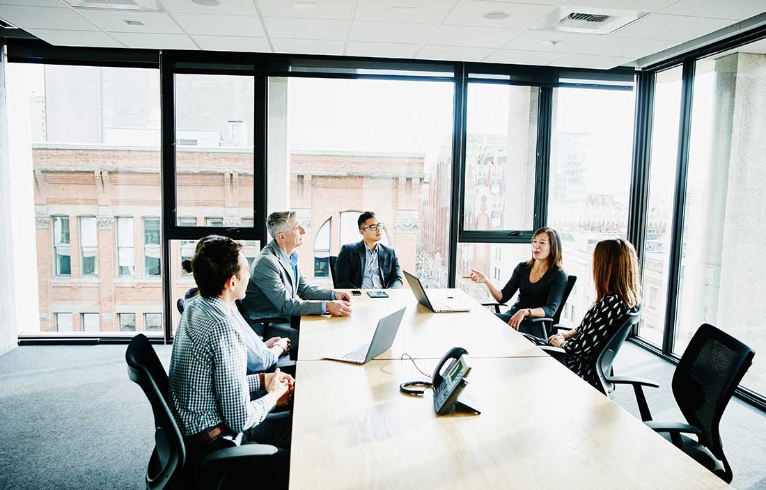 Business professional discussing and having a meeting in a conference room 