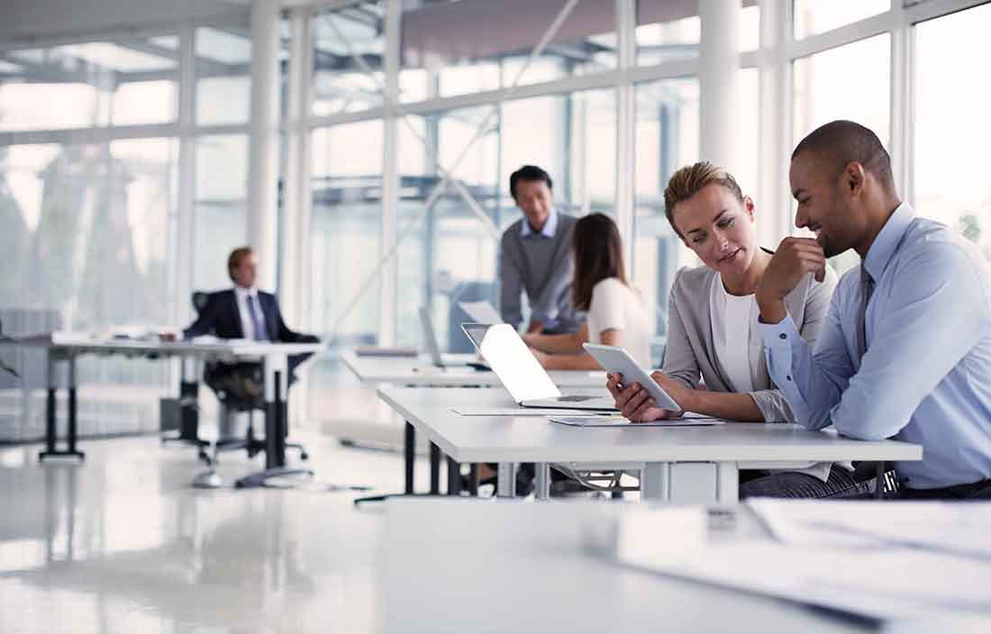 Business professionals in a modern conference room conducting a meeting.